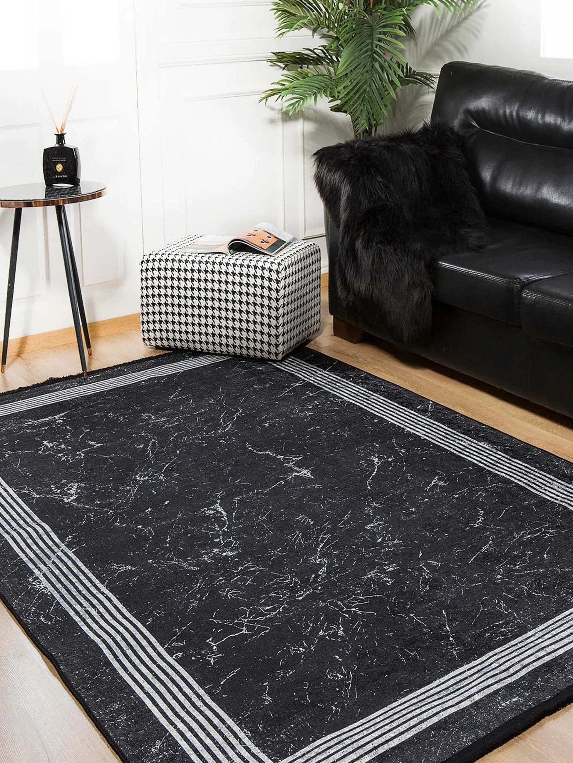 Black area rug, a stylish and modern option for living rooms and bedrooms.