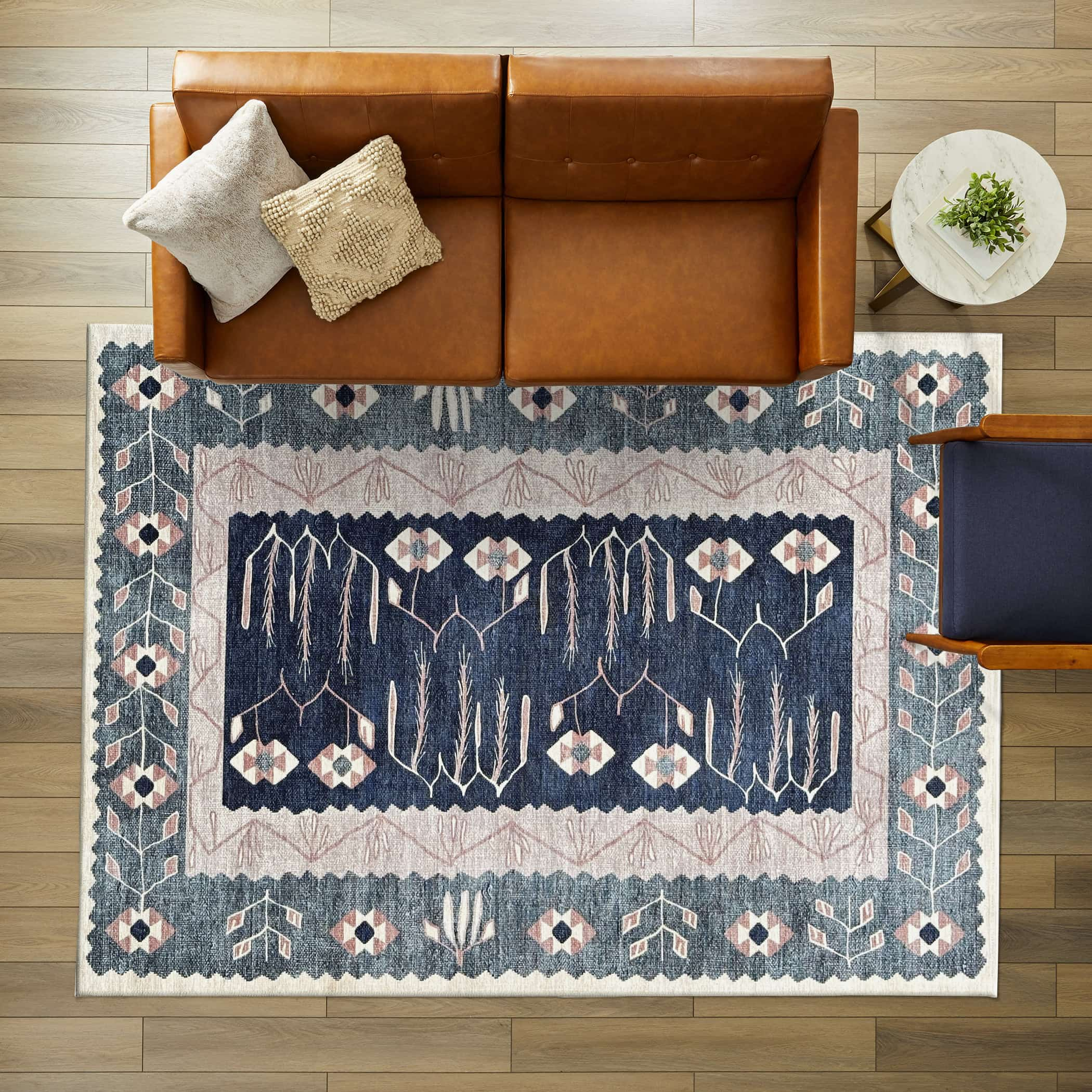 Cream and navy area rug, perfect for living rooms and bedrooms.